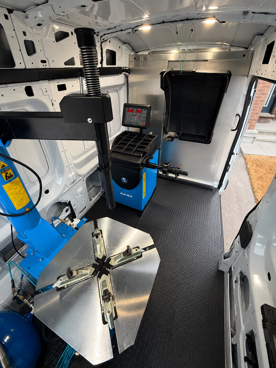 Professional tire equipment inside the AutoGroove mobile service van